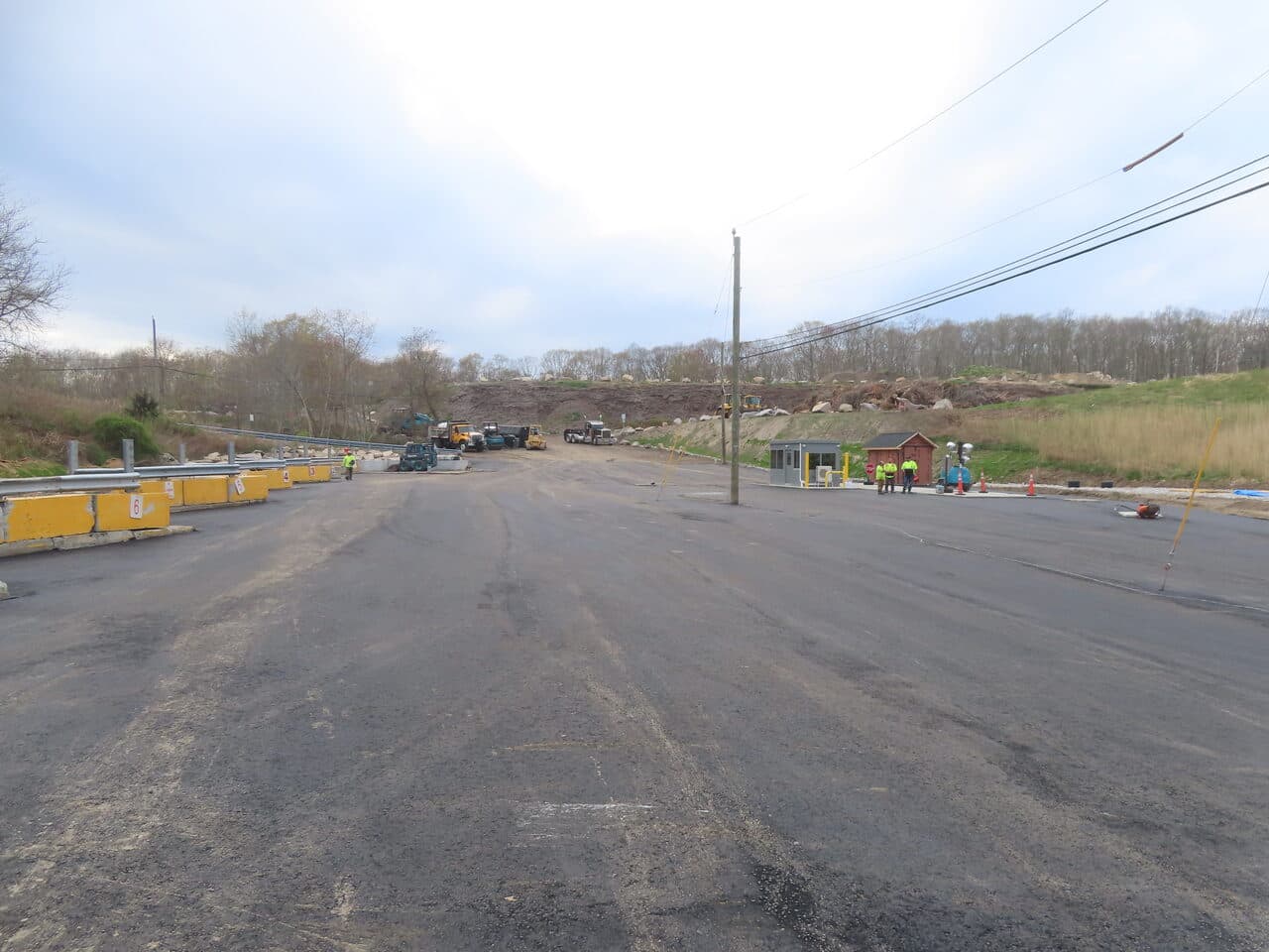Commercial Parking Lot Paving project in East Lyme, CT — wide paved lot with distant crew