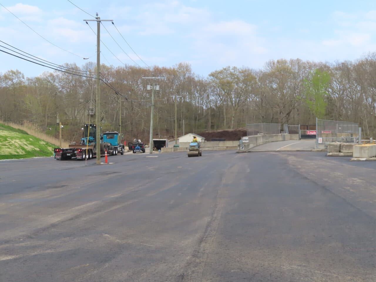 Commercial Parking Lot Paving project in East Lyme, CT — finished lot with equipment and ramp