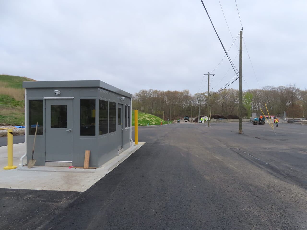 Commercial Parking Lot Paving project in East Lyme, CT — new guard booth on fresh asphalt