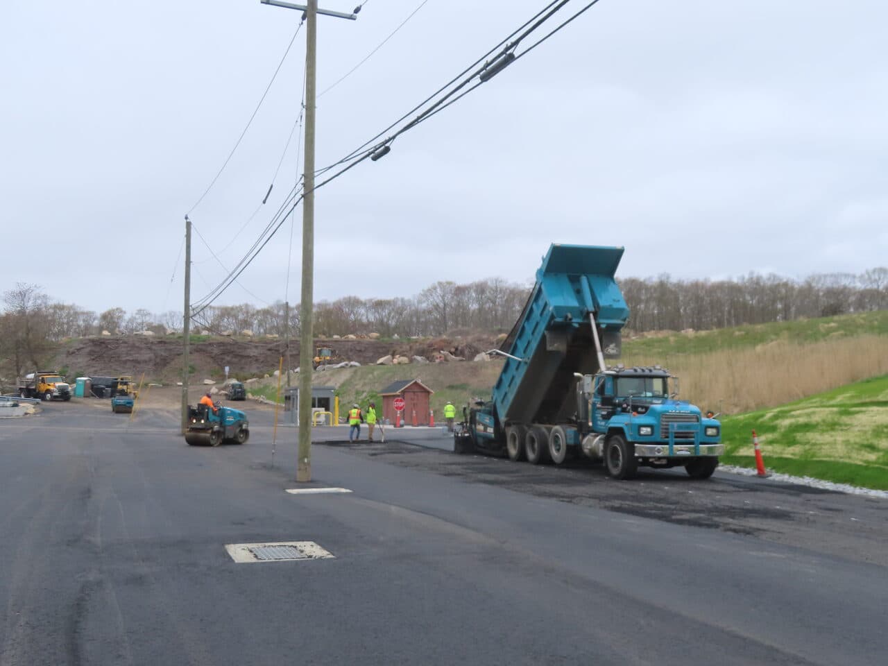 Commercial Parking Lot Paving project in East Lyme, CT — paving operation along roadway