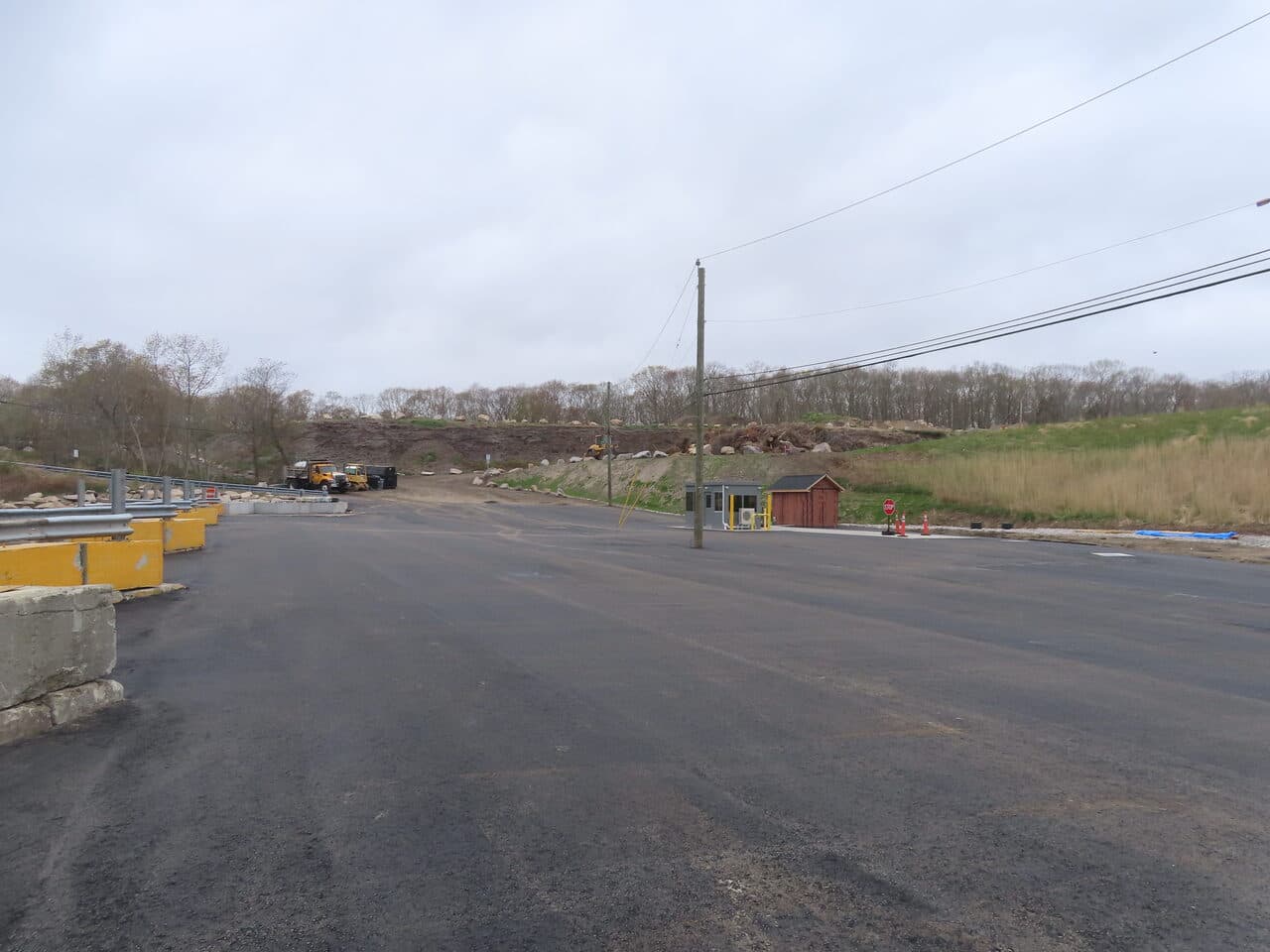 Commercial Parking Lot Paving project in East Lyme, CT — wide finished asphalt entrance lot