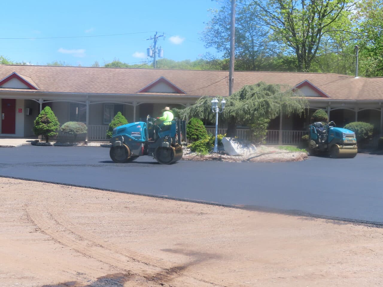 Commercial Parking Lot Paving project in Cheshire, CT — rollers compacting fresh asphalt