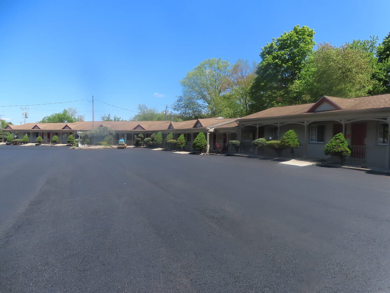 Commercial Parking Lot Paving project in Cheshire, CT — finished asphalt lot at motel