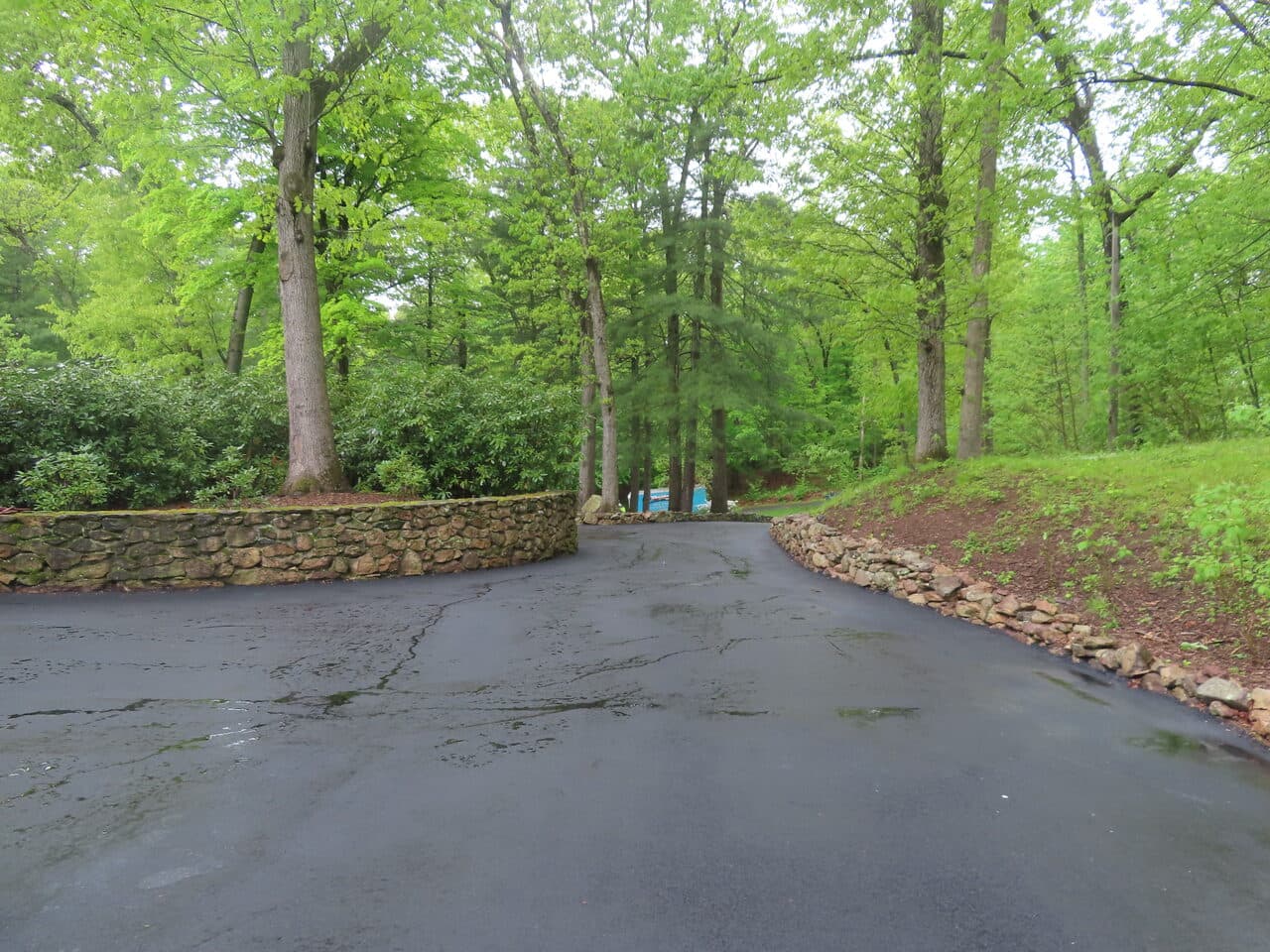 Residential Driveway Paving project in Hamden, CT — curved driveway loop with stone wall