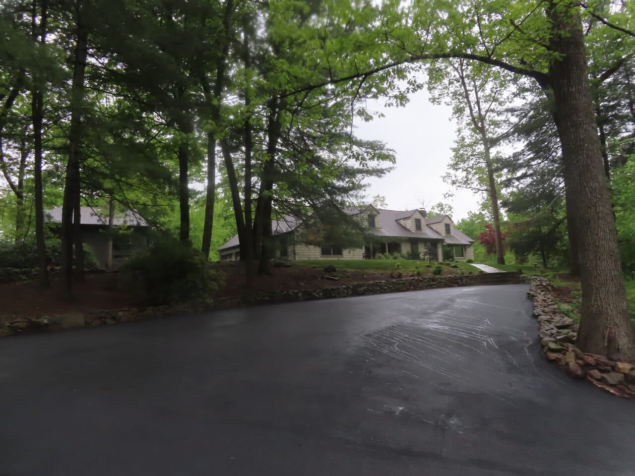 Residential Driveway Paving project in Hamden, CT — wide driveway with house in background