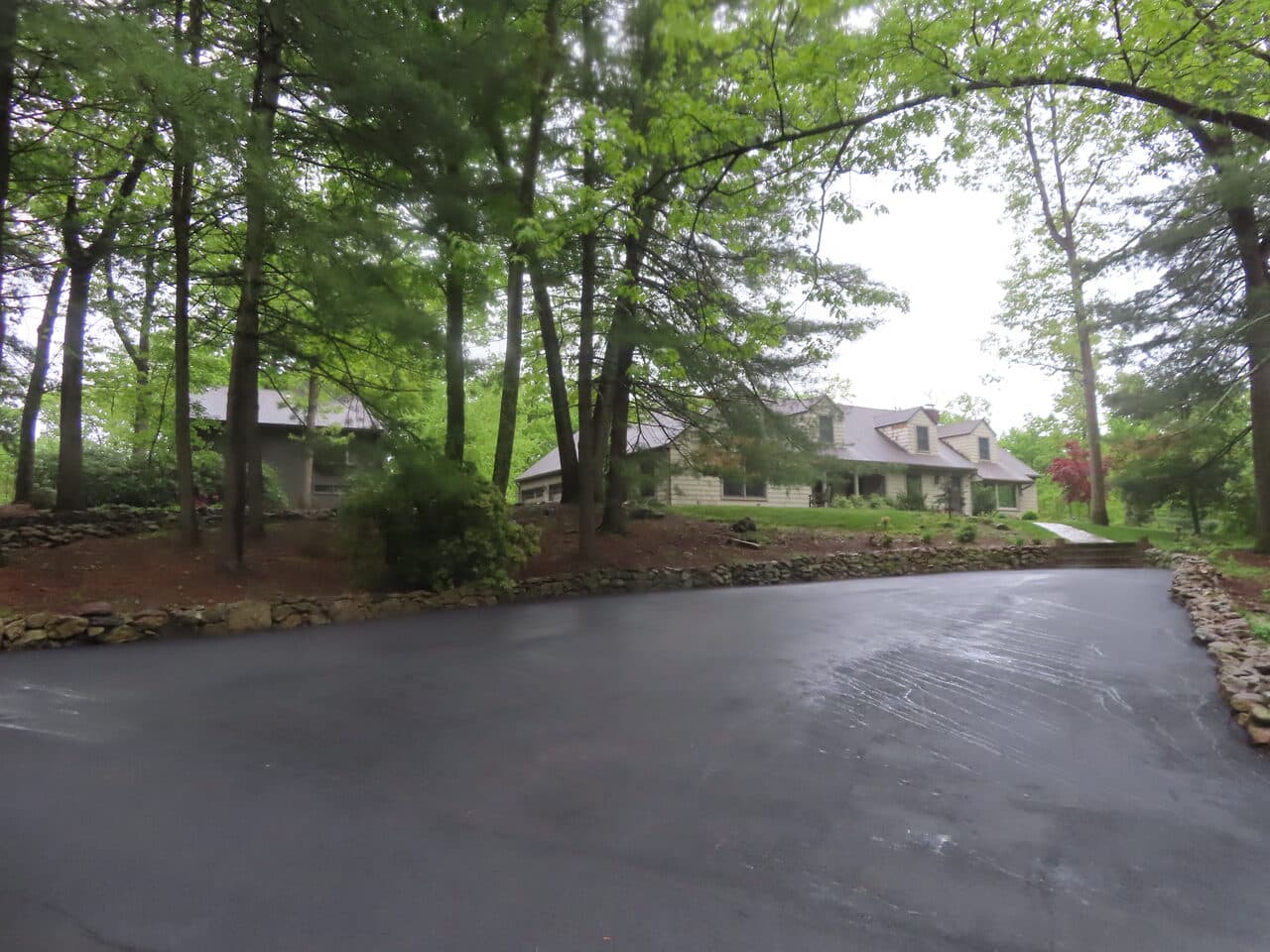Residential Driveway Paving project in Hamden, CT — finished driveway pan toward house