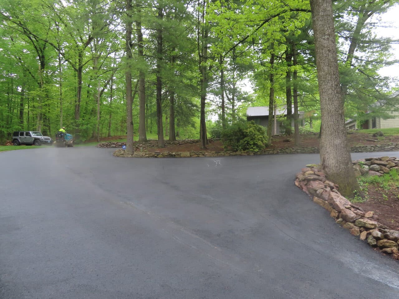 Residential Driveway Paving project in Hamden, CT — driveway loop with parked work truck