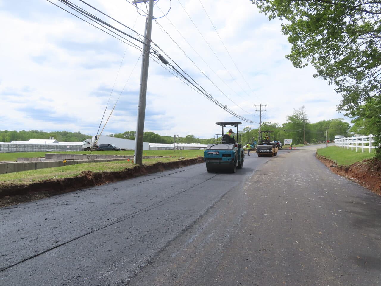 Roadway Paving project in Cheshire, CT — roller compacting fresh asphalt road