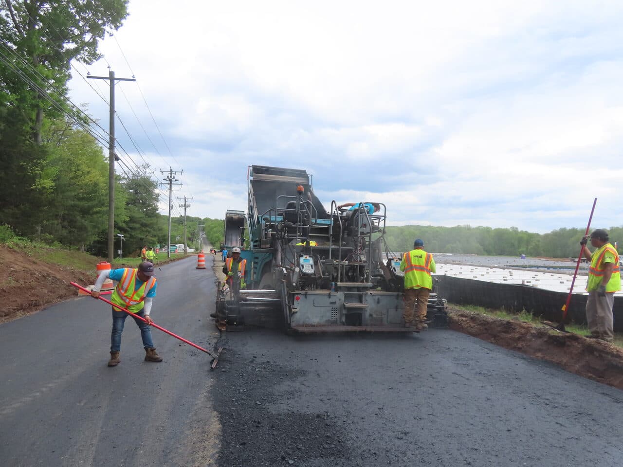 Roadway Paving project in Cheshire, CT — paver and crew on roadway