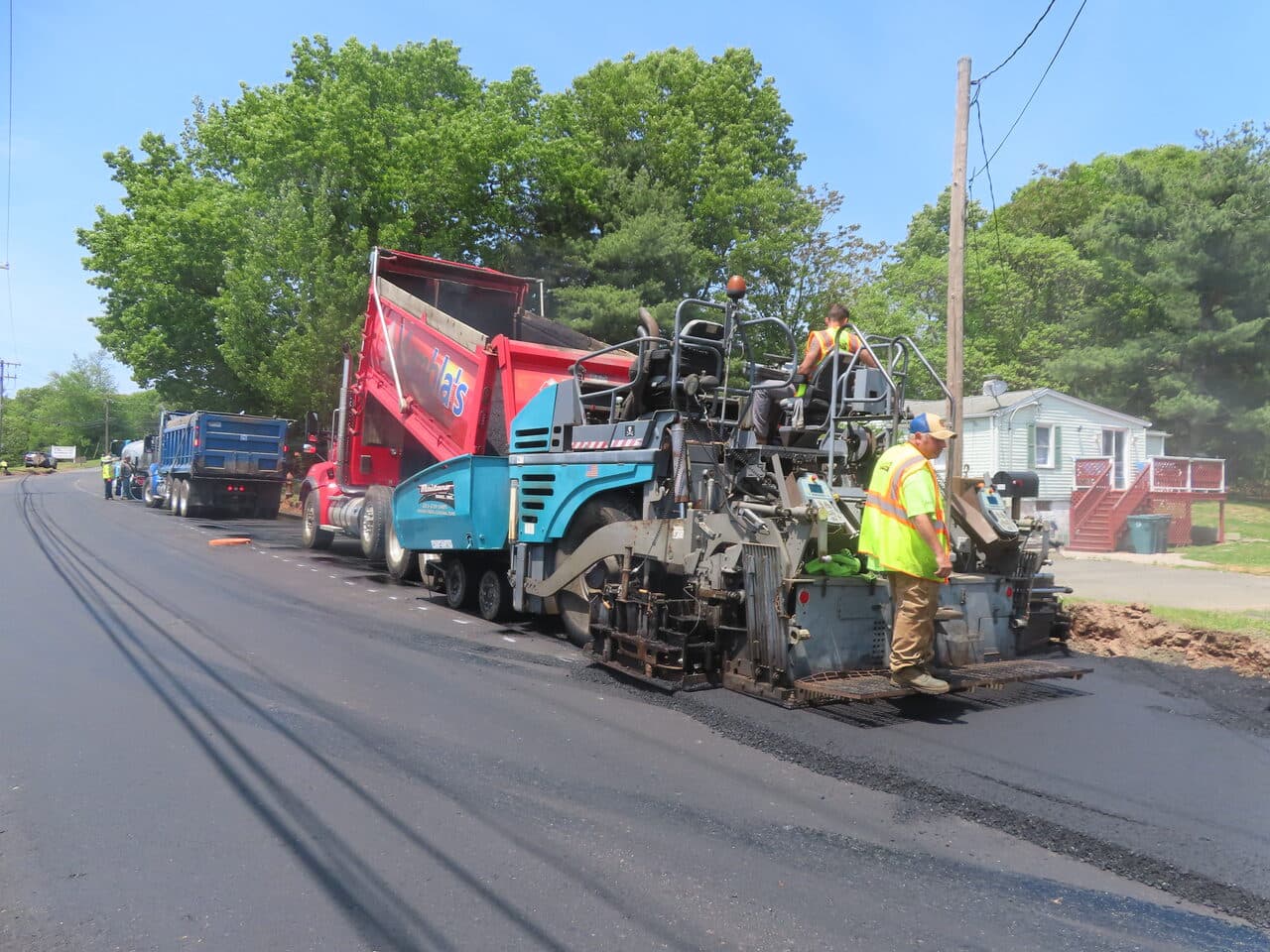 Roadway Paving project in Cheshire, CT — asphalt paver laying new mat