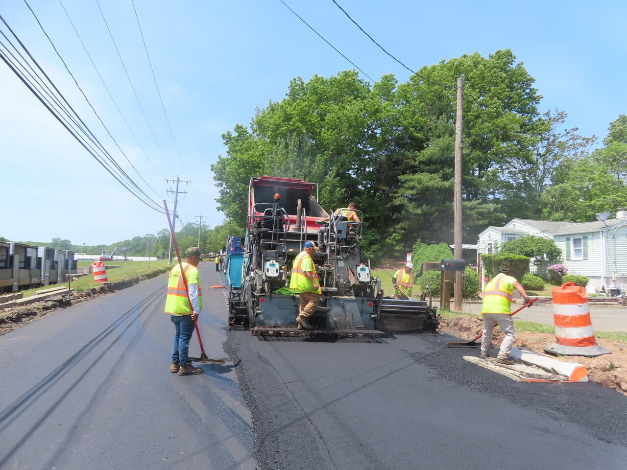 Roadway Paving project in Cheshire, CT — crew paving road with paver