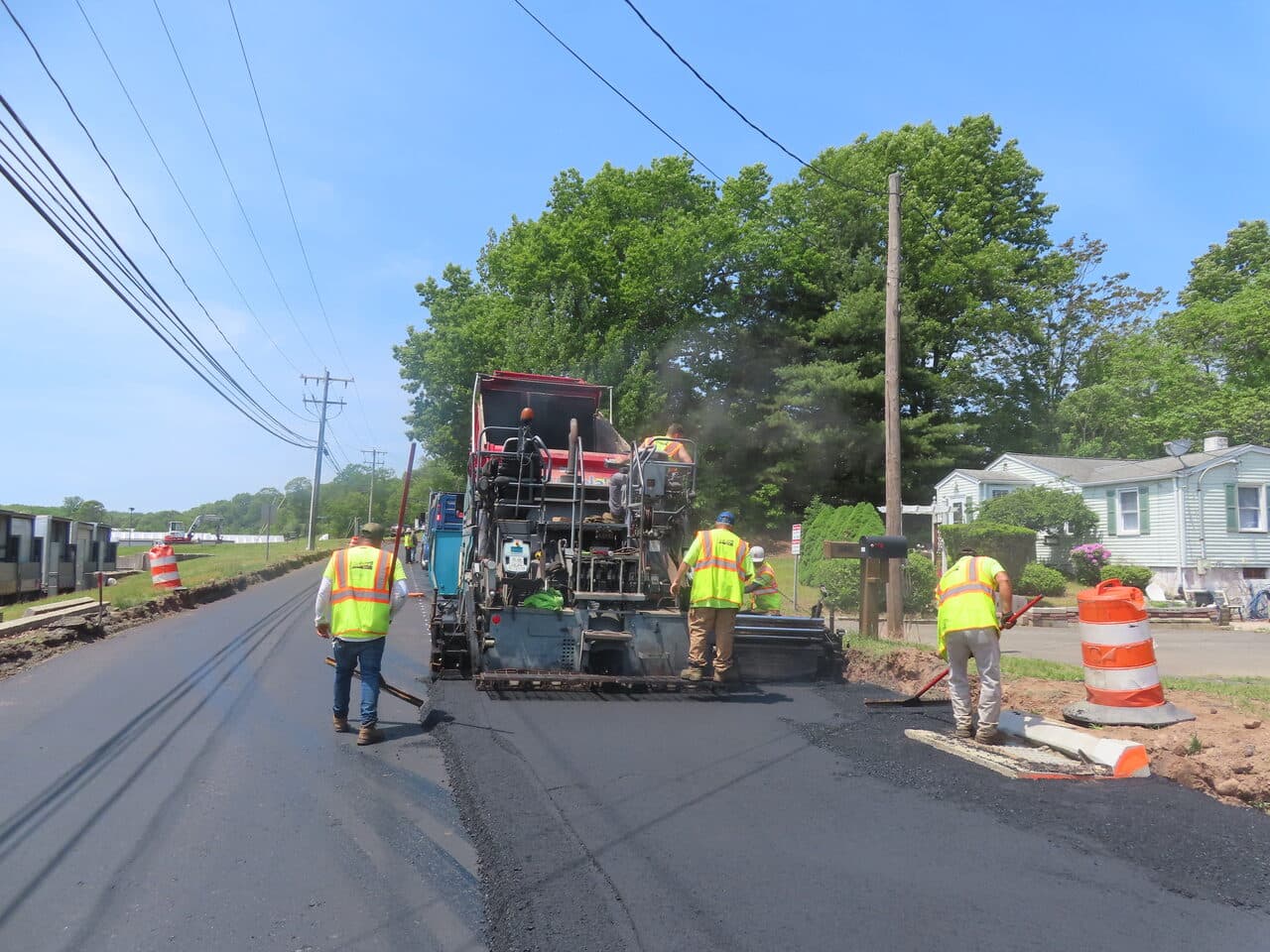 Roadway Paving project in Cheshire, CT — crew paving residential road