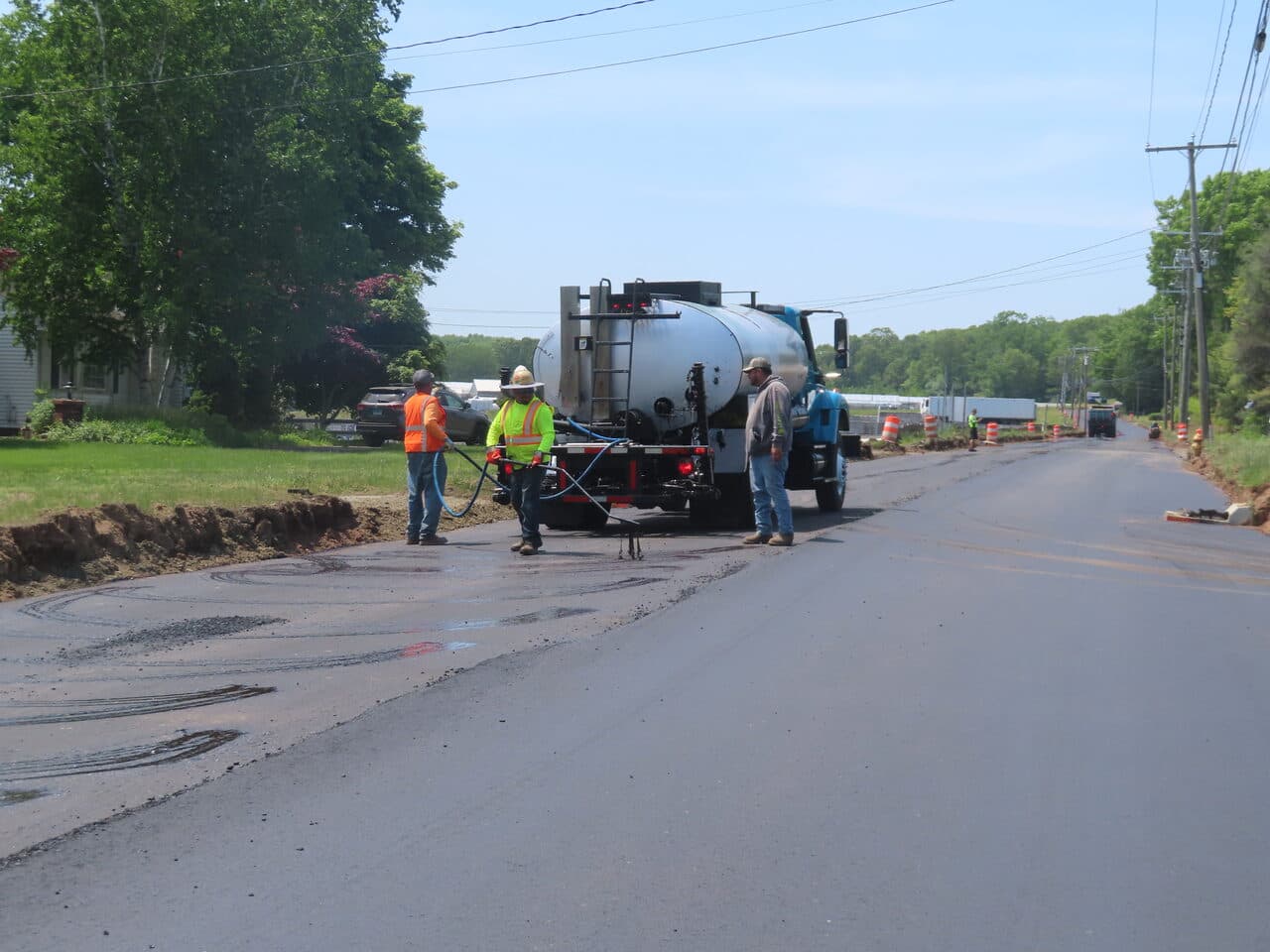 Roadway Paving project in Cheshire, CT — tack coat crew on wide road