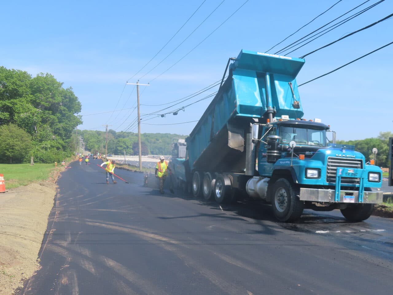 Commercial Night Parking Lot Paving project in Pittsburgh, PA — blue dump truck on roadway