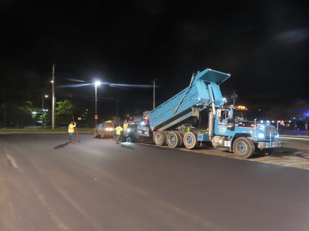 Commercial Night Parking Lot Paving project in Pittsburgh, PA — night paving with blue dump truck