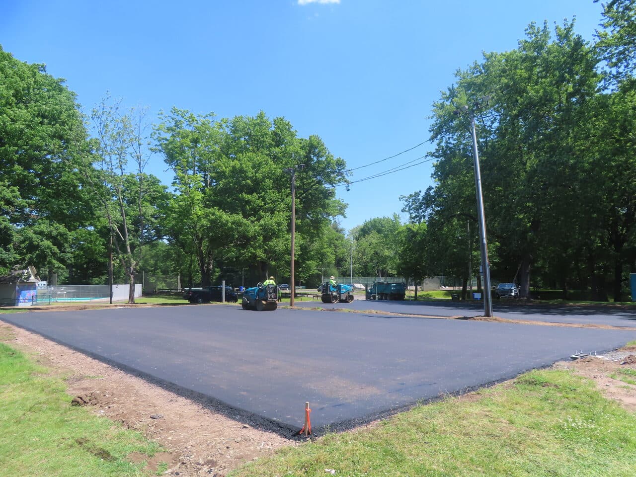 Parking Lot & Athletic Surface Base Paving project in East Hartford, CT — freshly paved asphalt lot