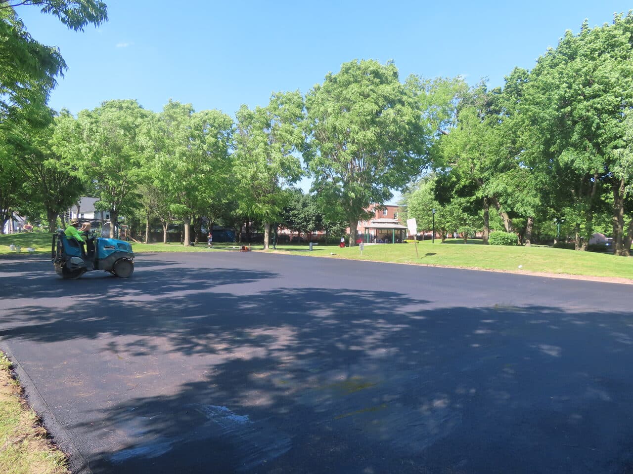 Parking Lot & Athletic Surface Base Paving project in East Hartford, CT — wide new asphalt drive lot