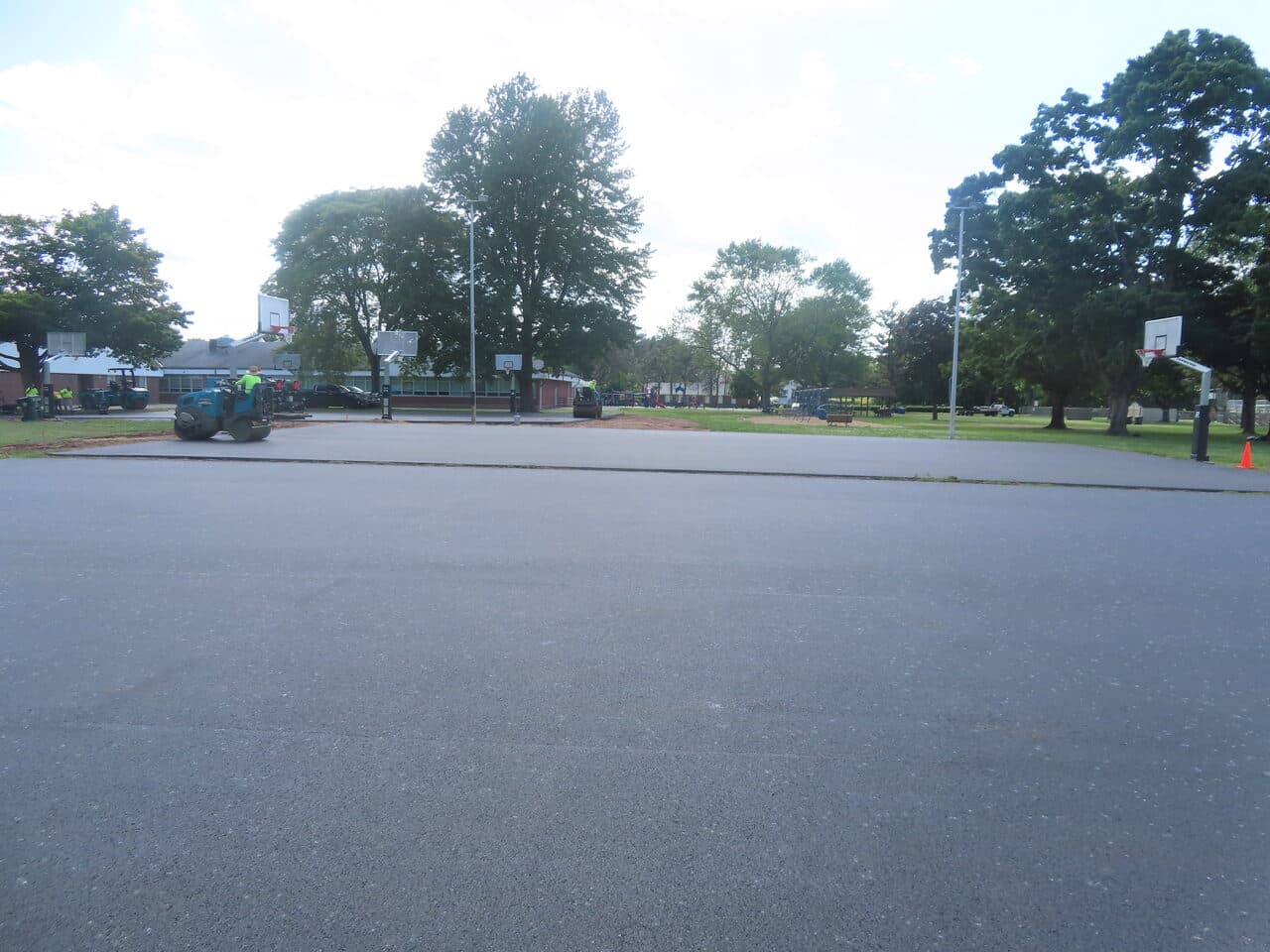 Parking Lot & Athletic Surface Base Paving project in East Hartford, CT — fresh paved basketball court area