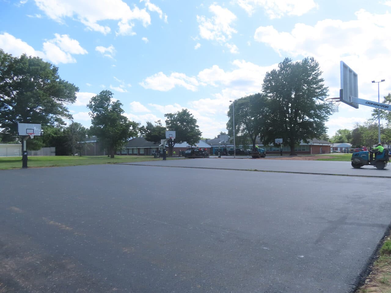 Parking Lot & Athletic Surface Base Paving project in East Hartford, CT — newly paved court at school park