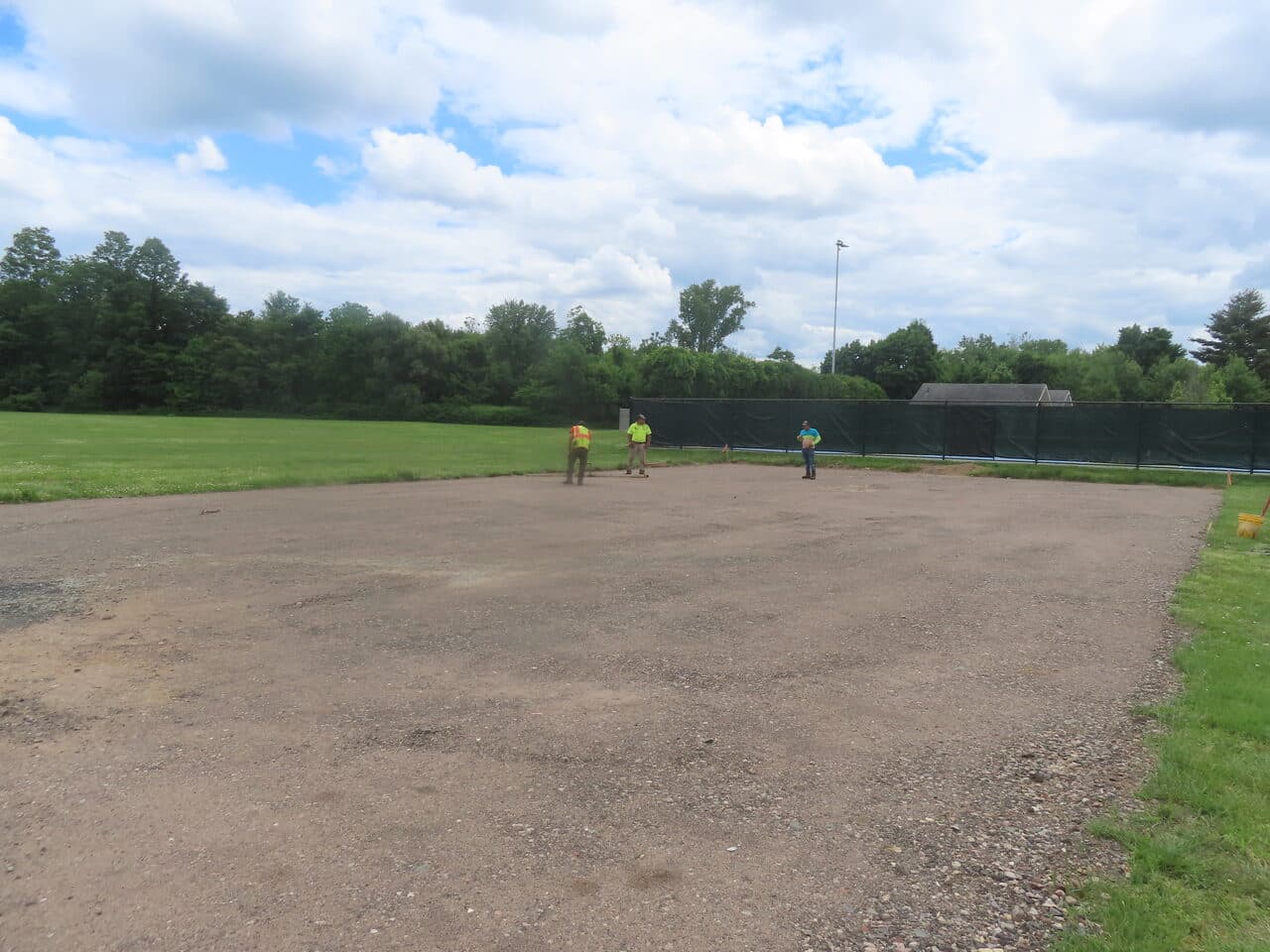 Parking Lot & Athletic Surface Base Paving project in East Hartford, CT — graded gravel base before paving