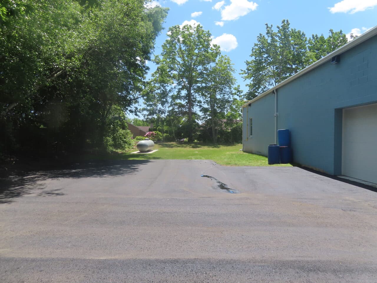 Commercial Parking Lot Paving project in Branford, CT — side area before paving near building