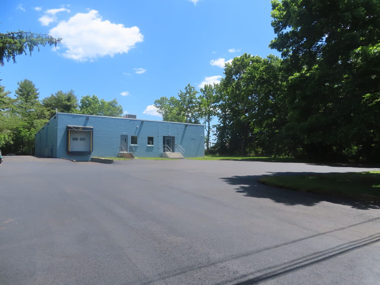 Commercial Parking Lot Paving project in Branford, CT — finished blue commercial building lot