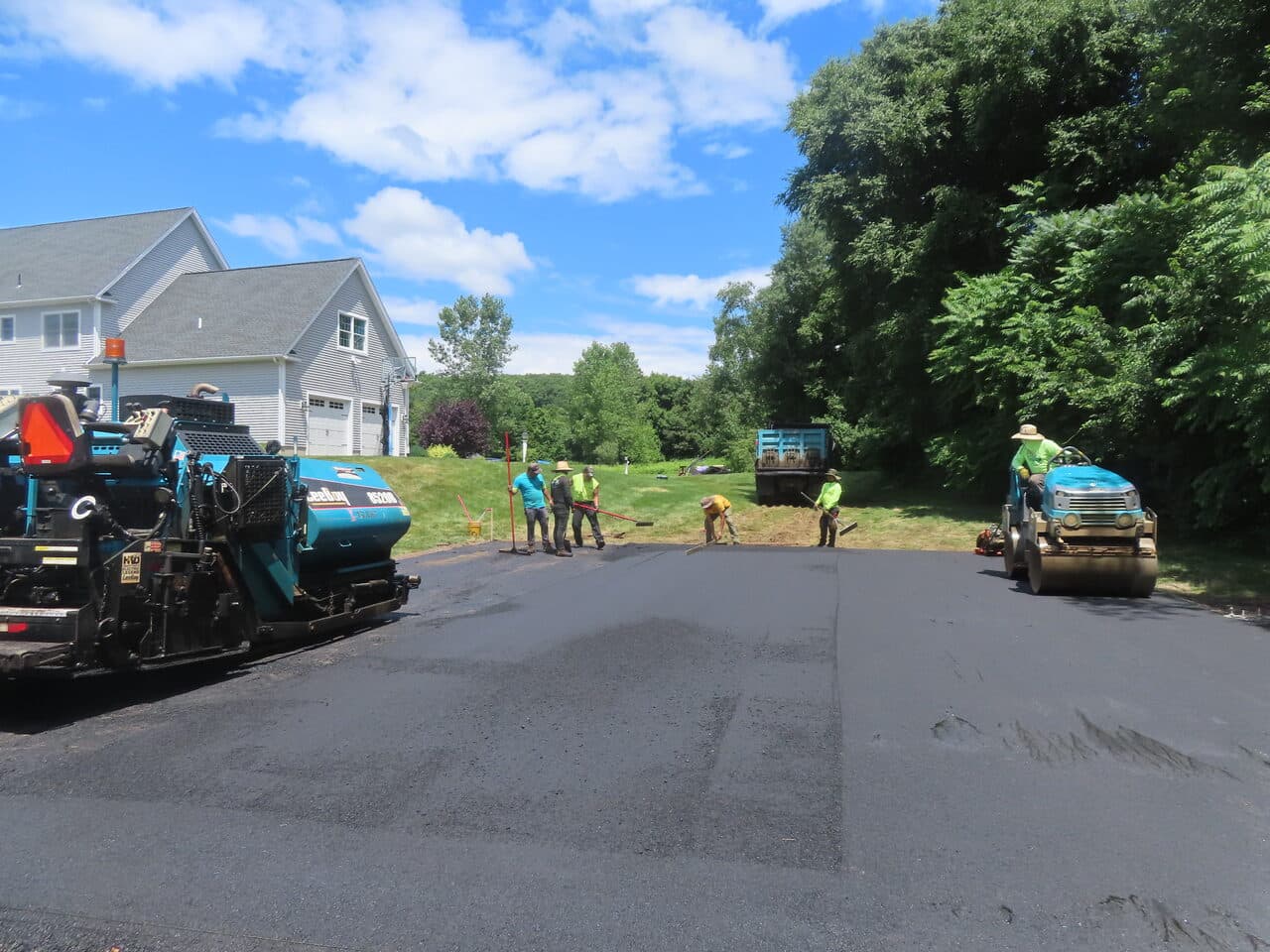Asphalt Pad Paving project in North Haven, CT — paving crew and equipment on driveway
