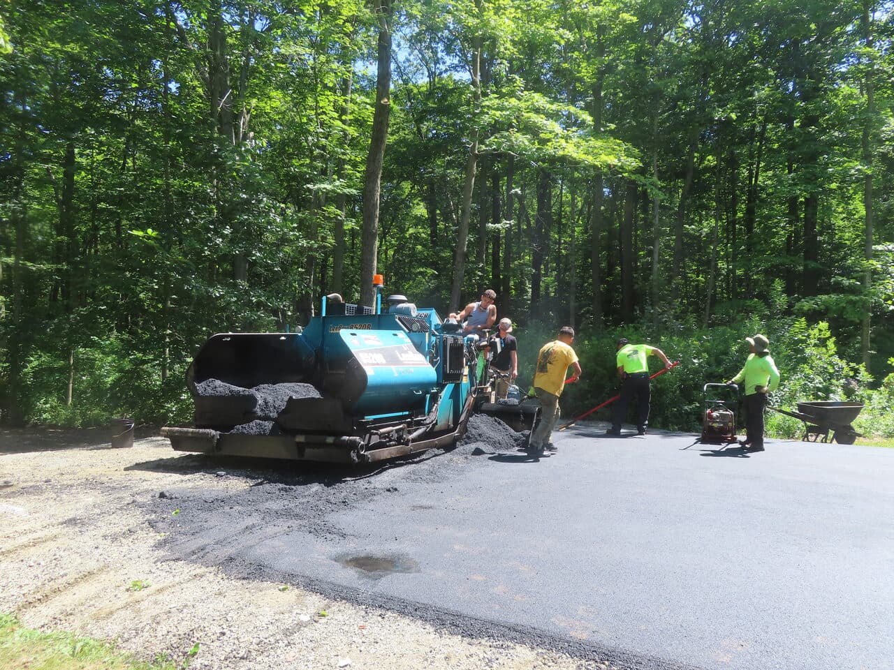 Multi-Stop Residential Driveway Paving project in Durham & Wallingford, CT — asphalt paver laying driveway