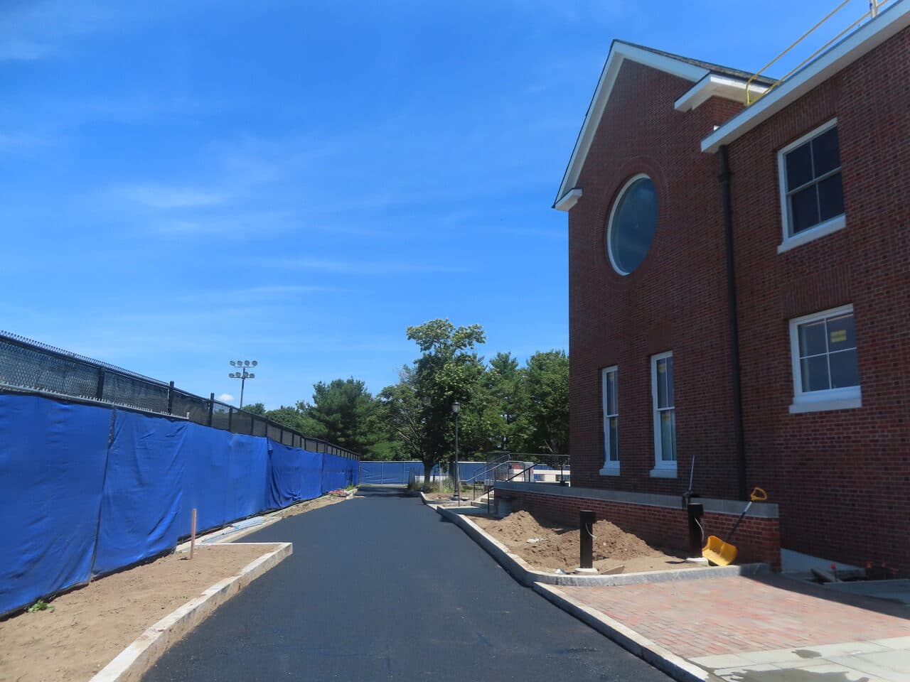 Institutional Asphalt Paving project in New Haven, CT — fresh paved walkway along building