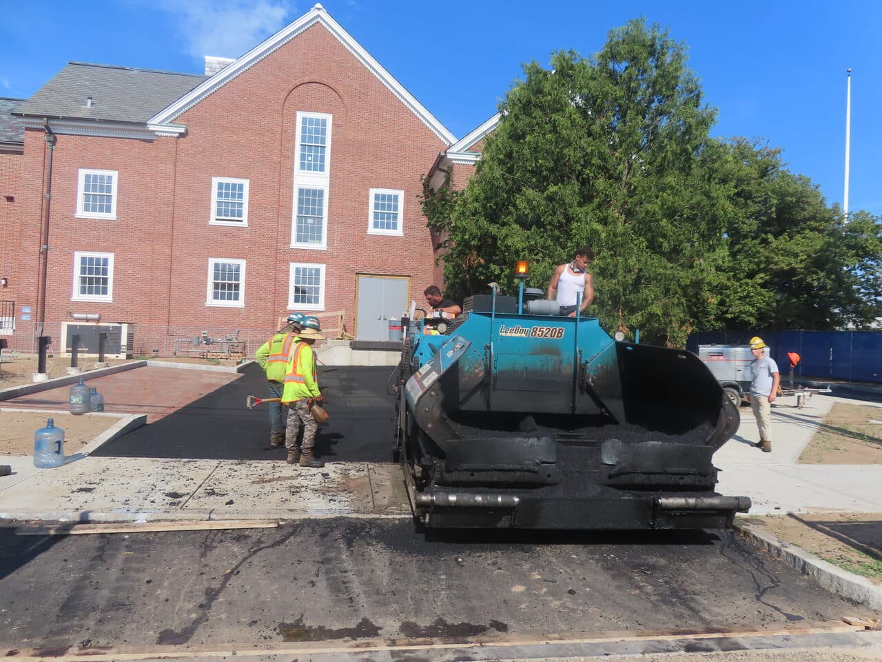 Institutional Asphalt Paving project in New Haven, CT — asphalt paver laying mat at plaza