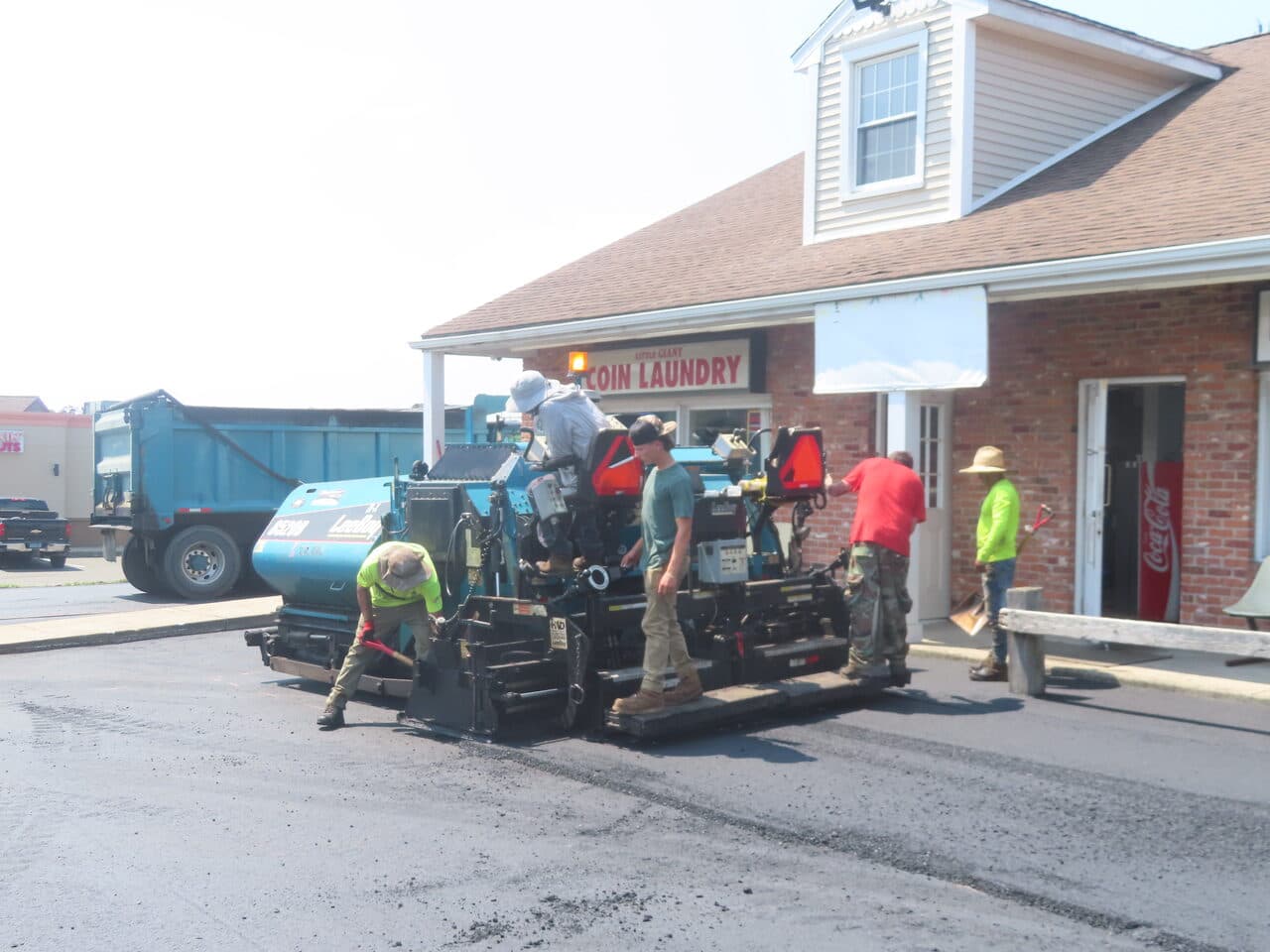 Commercial Plaza Paving project in New Haven, CT — asphalt paver laying mat at commercial plaza