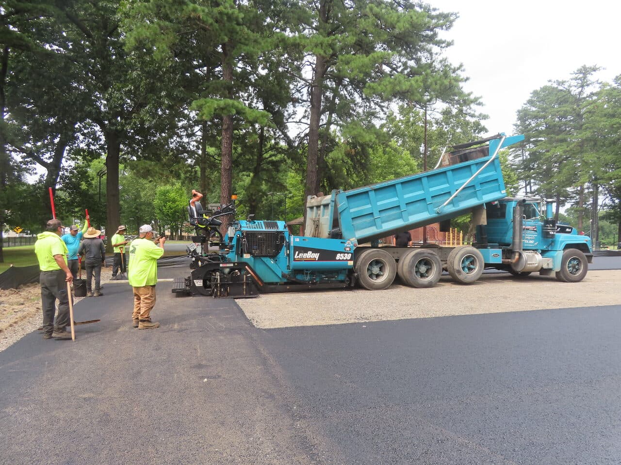 Commercial Parking Lot Paving project in Springfield, MA — crew paving lot with paver and dump truck
