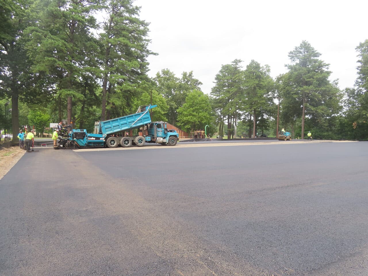 Commercial Parking Lot Paving project in Springfield, MA — wide fresh asphalt lot during paving