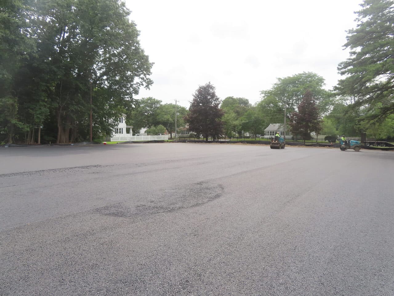 Commercial Parking Lot Paving project in Springfield, MA — finished asphalt lot near homes