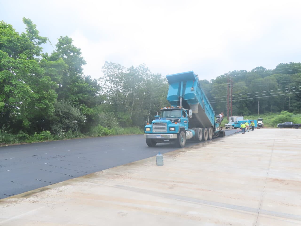 Commercial Parking Lot Paving project in Northford, CT — dump truck on edge of new asphalt