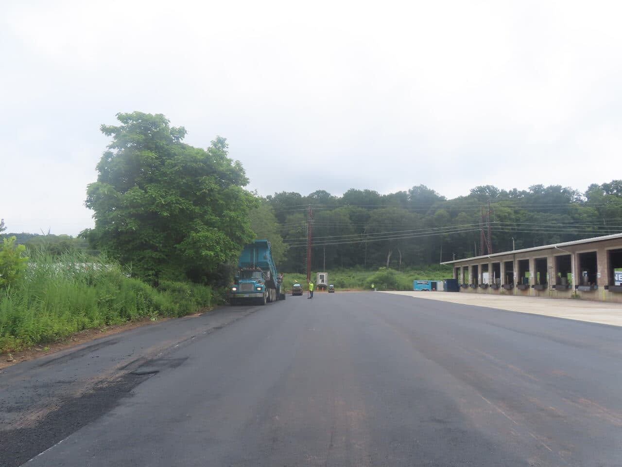 Commercial Parking Lot Paving project in Northford, CT — wide lot view toward loading dock