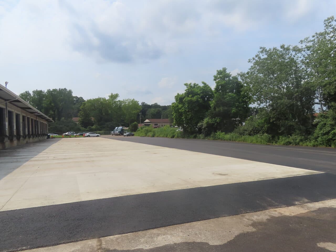 Commercial Parking Lot Paving project in Northford, CT — finished asphalt meeting concrete apron