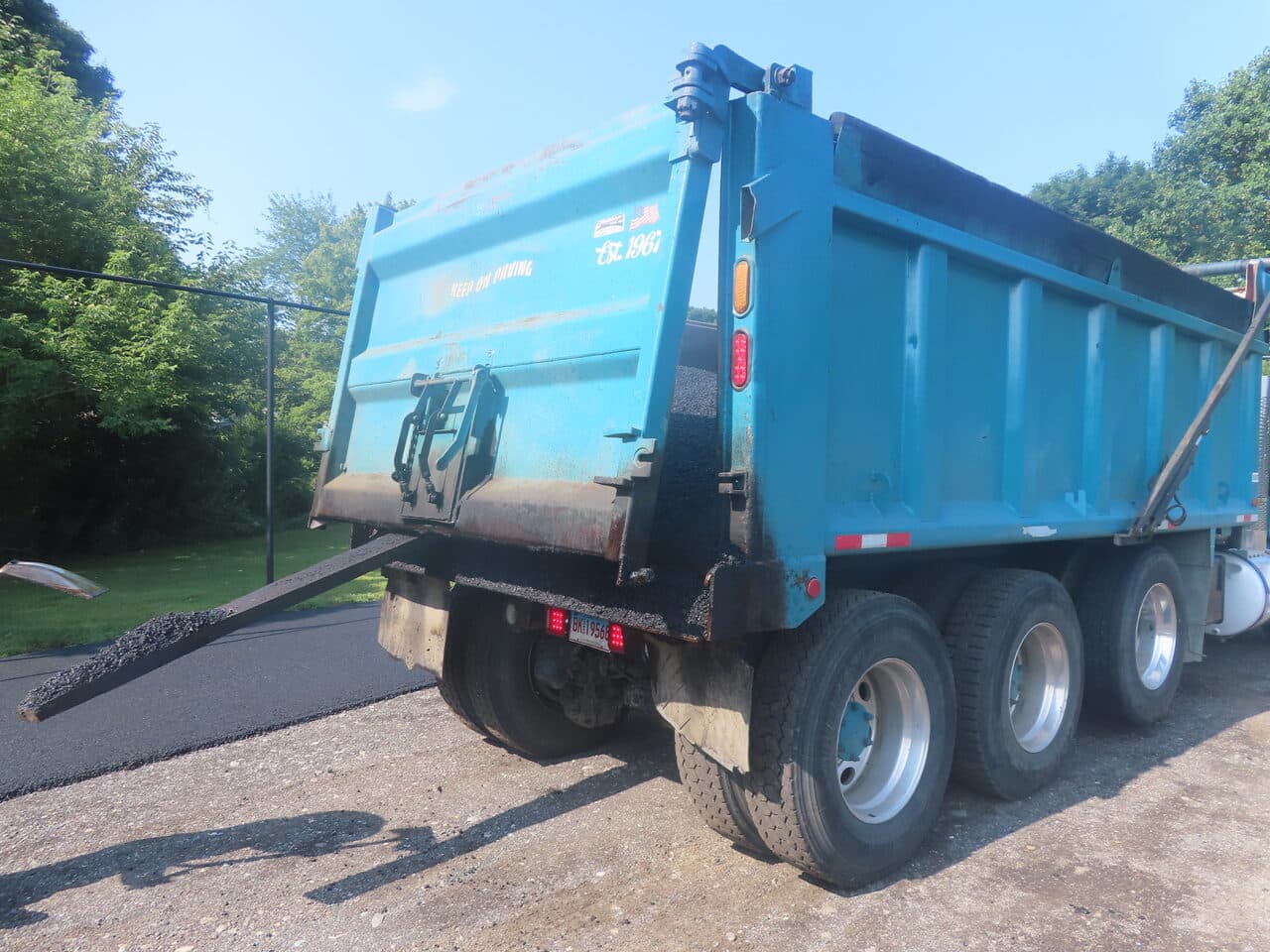 Commercial Parking Lot Paving project in Barrington, RI — asphalt pile beside dump truck