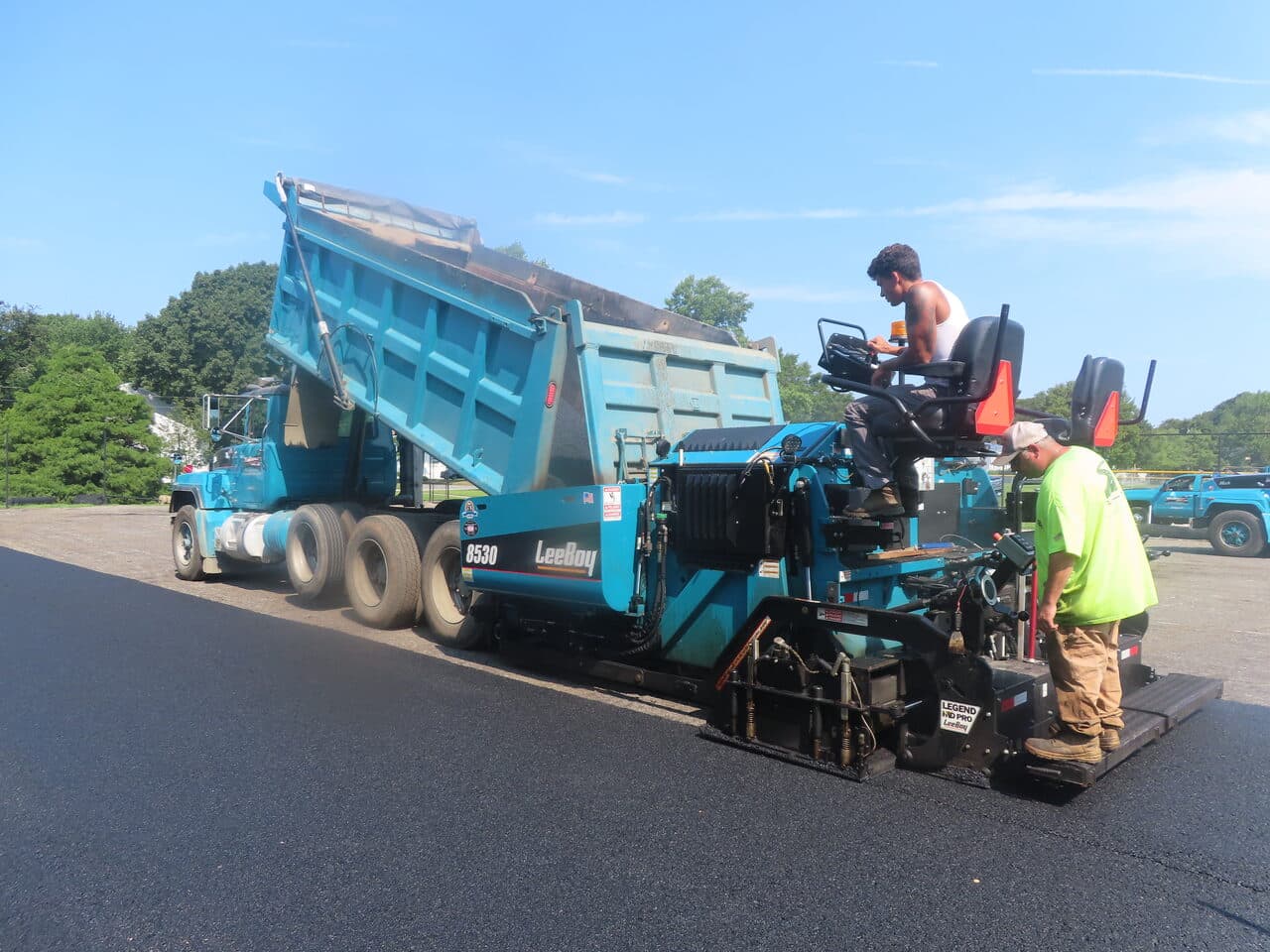 Commercial Parking Lot Paving project in Barrington, RI — LeeBoy paver laying asphalt