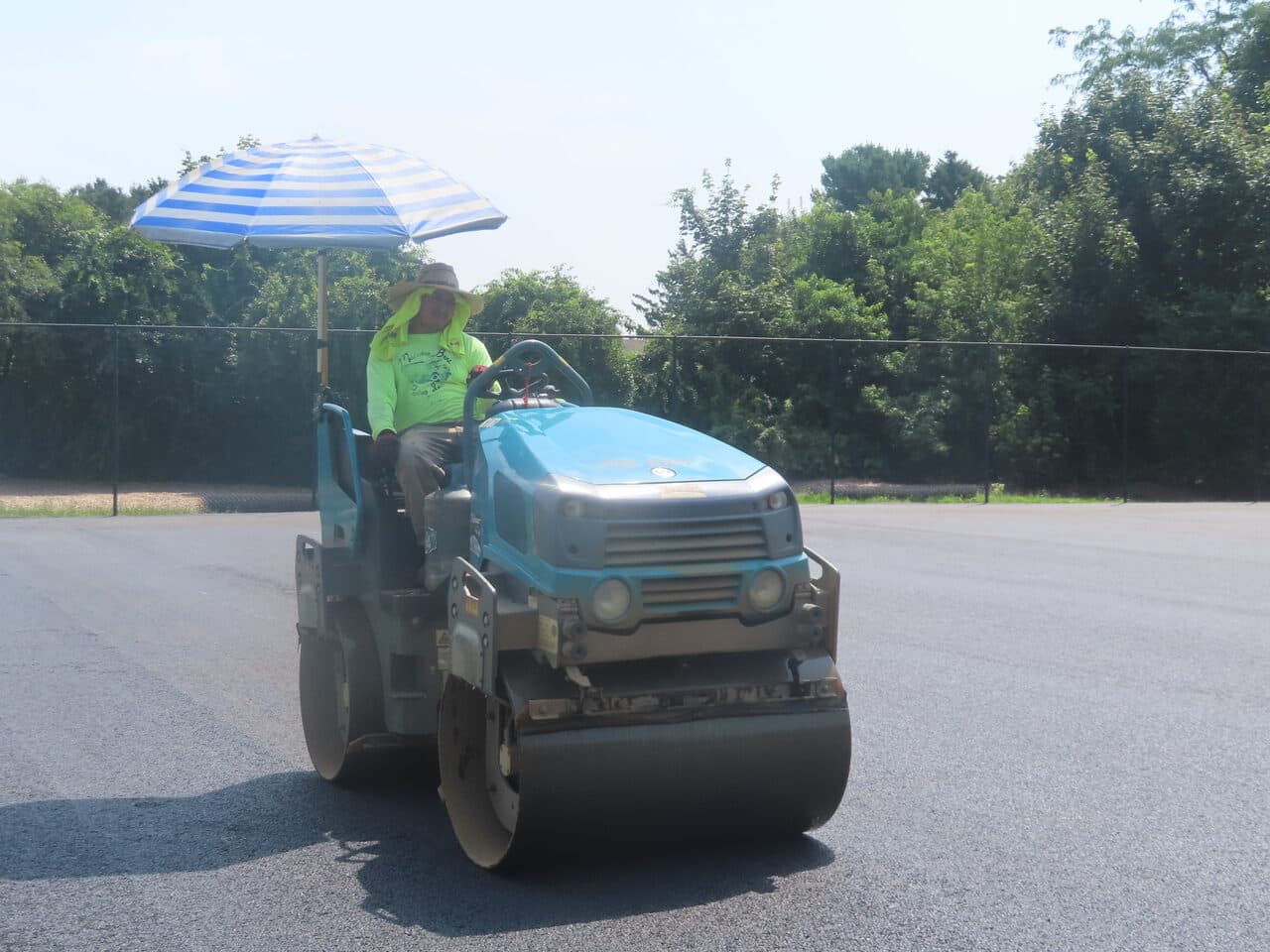 Commercial Parking Lot Paving project in Barrington, RI — roller compacting fresh asphalt