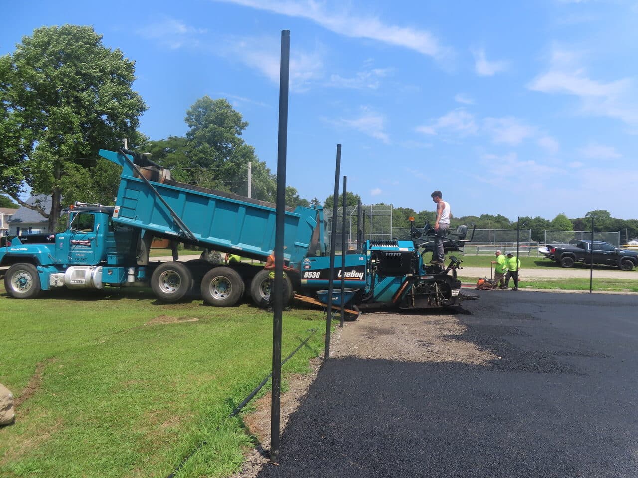 After — Commercial Parking Lot Paving in Barrington, RI (gravel base before paving fence)
