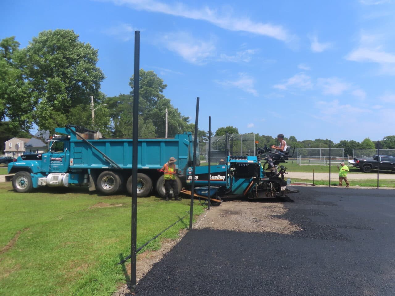 Before — Commercial Parking Lot Paving in Barrington, RI (gravel base before paving fence)