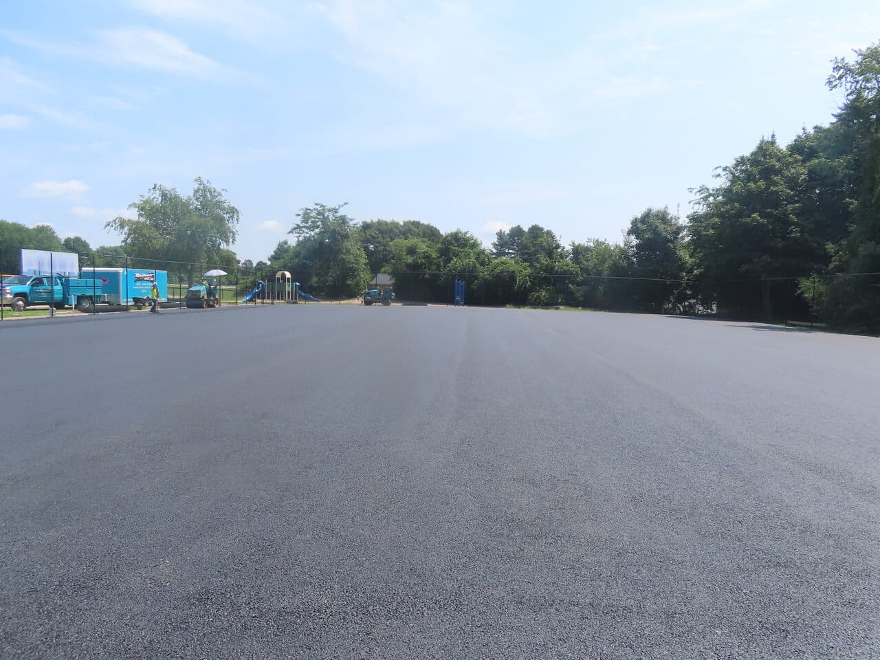 Commercial Parking Lot Paving project in Barrington, RI — finished asphalt lot wide view