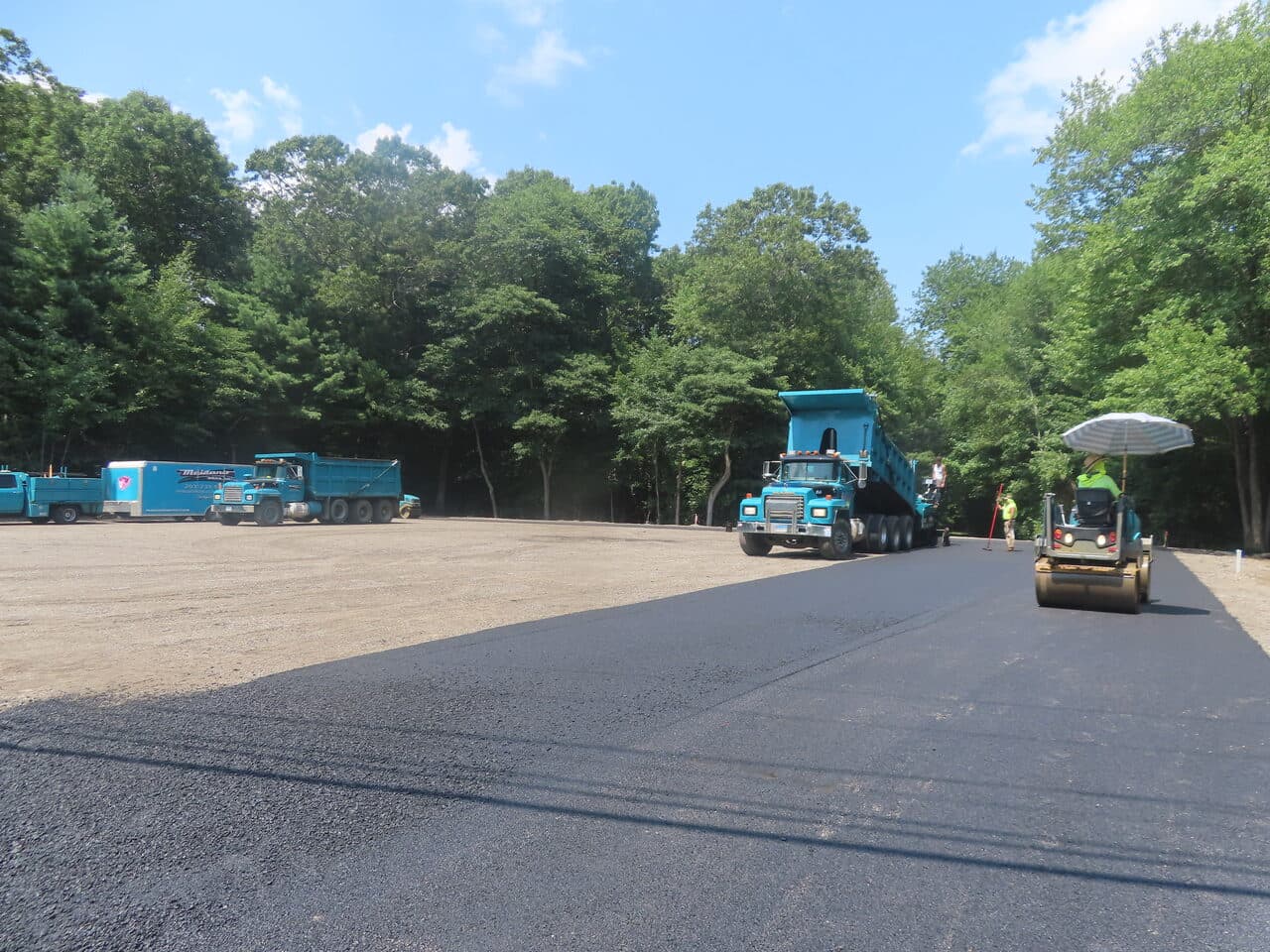 Commercial Parking Lot Paving project in Barrington, RI — paving in progress with roller