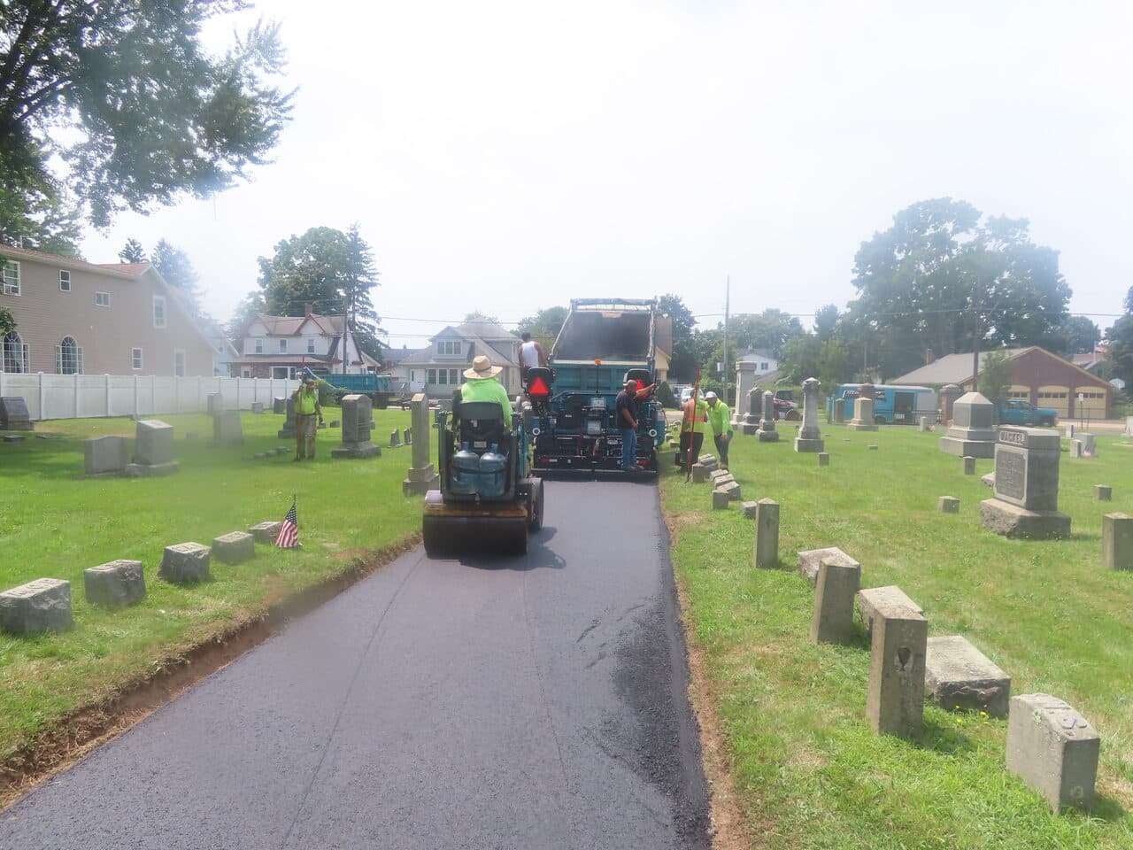 Cemetery Roadway & Walkway Paving project in East Haven, CT — paving train rolling cemetery path
