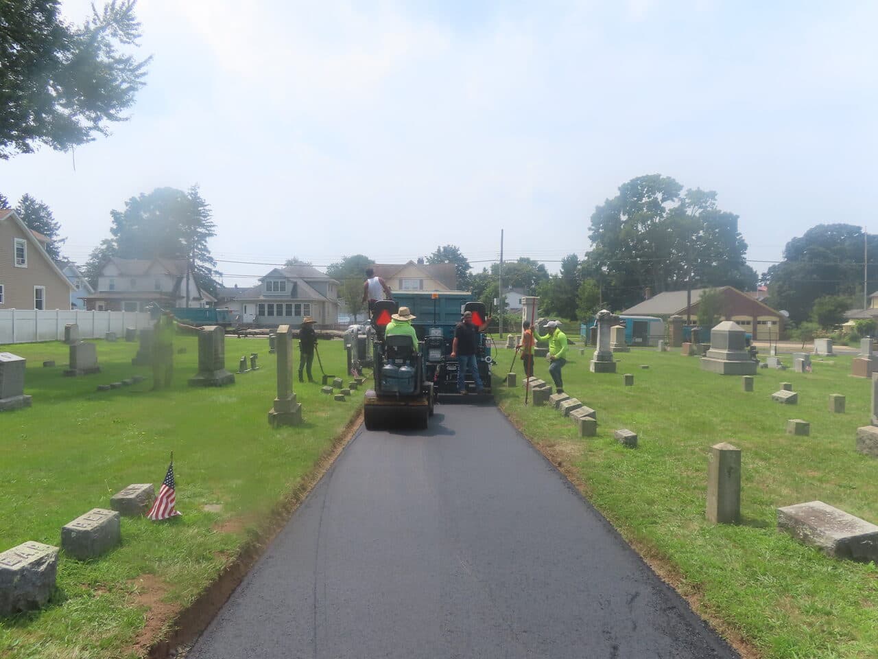 Cemetery Roadway & Walkway Paving project in East Haven, CT — crew paving narrow cemetery lane