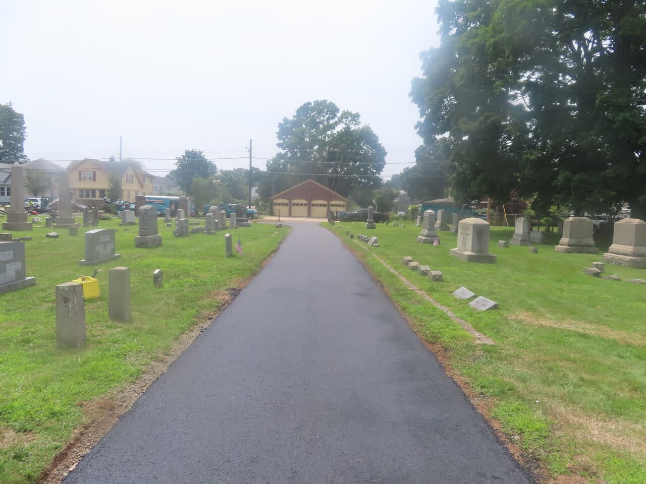 Cemetery Roadway & Walkway Paving project in East Haven, CT — finished lane toward garage building