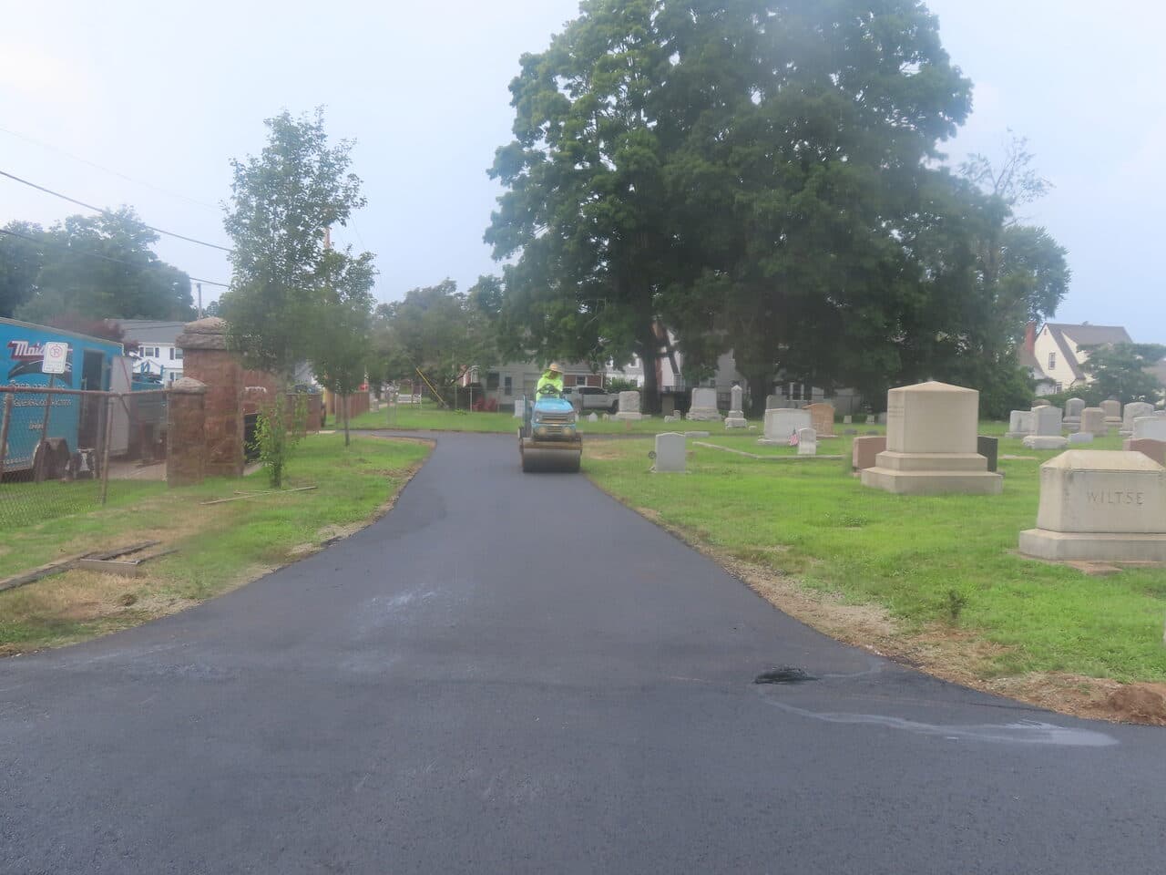 Cemetery Roadway & Walkway Paving project in East Haven, CT — roller compacting fresh asphalt lane