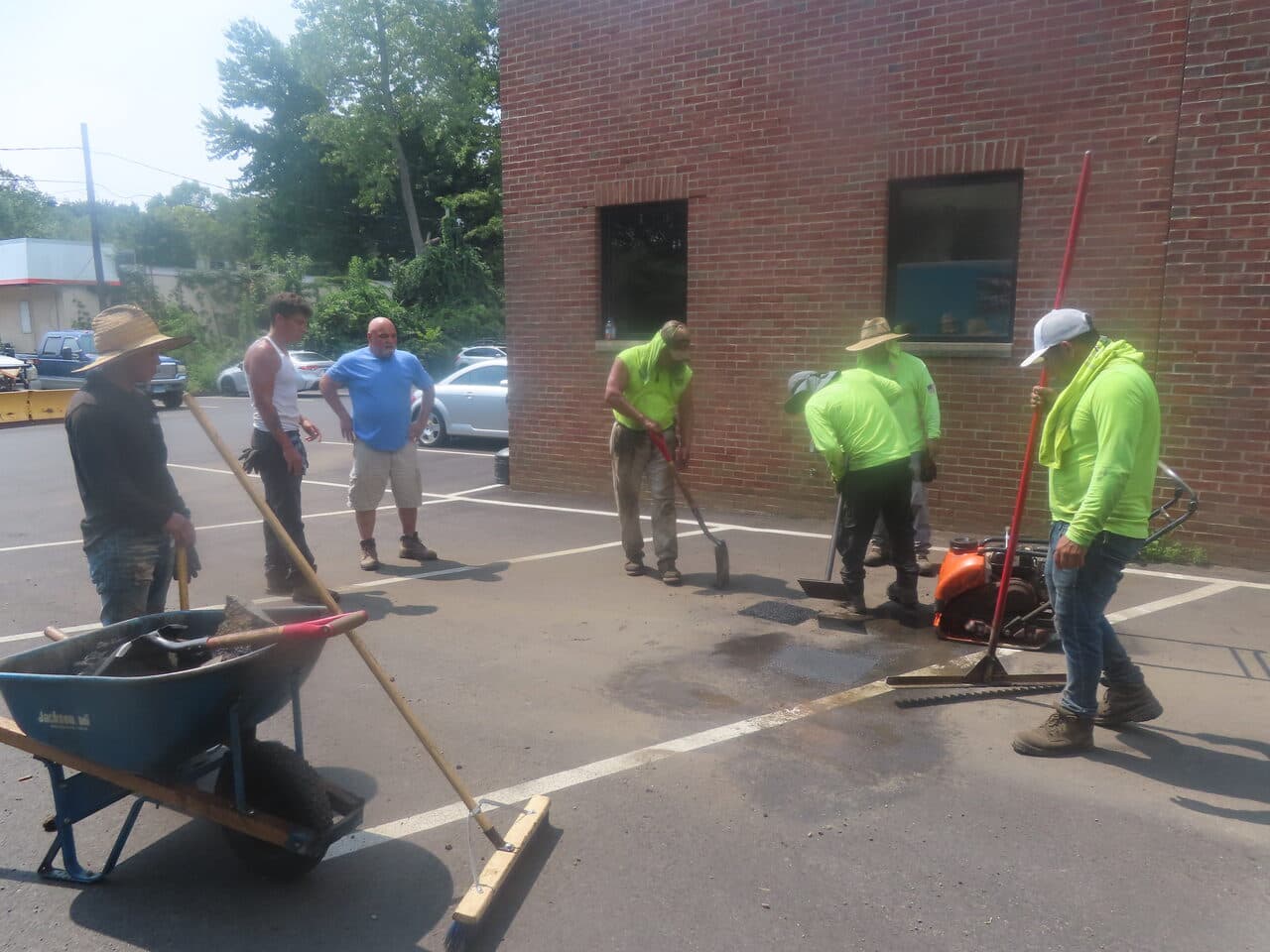 Cemetery Roadway & Walkway Paving project in East Haven, CT — crew patching parking lot asphalt