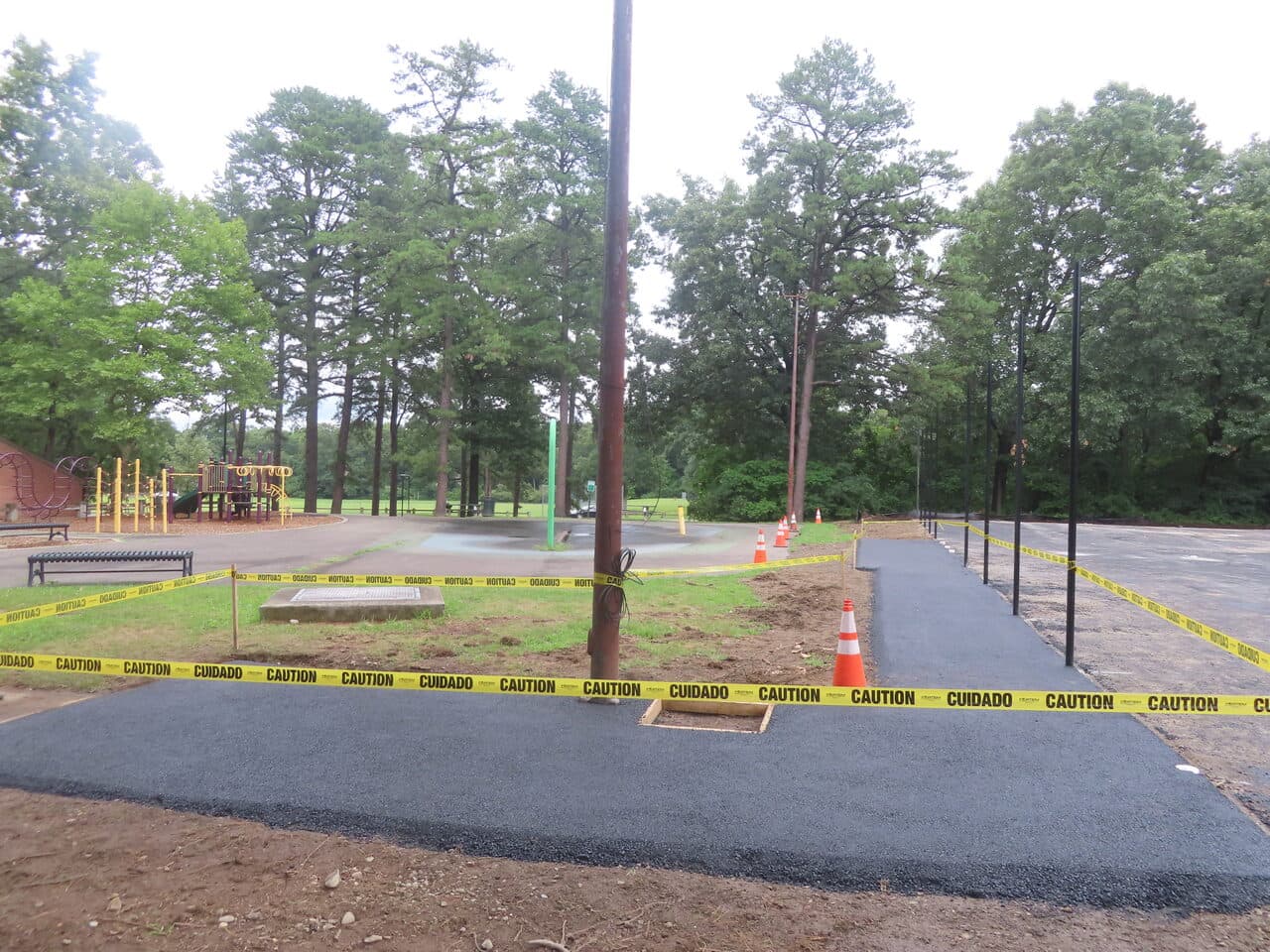 Asphalt Walkway Paving project in Springfield, MA — new asphalt path with caution tape